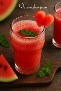 Homemade watermelon juice served in a clear glass with mint garnish, refreshing no-added-sugar summer drink