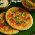 Instant oats uthappam topped with onion, tomato, carrot, green chili, and idli podi served on a rustic plate