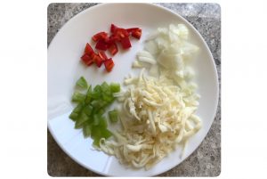 chop veggies for bread pizza bombs