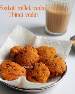 Crispy Thinai Vadai served on a banana leaf with coconut chutney and ginger tea