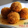Crispy kodo millet arancini on a rustic plate