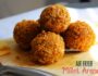Crispy kodo millet arancini on a rustic plate