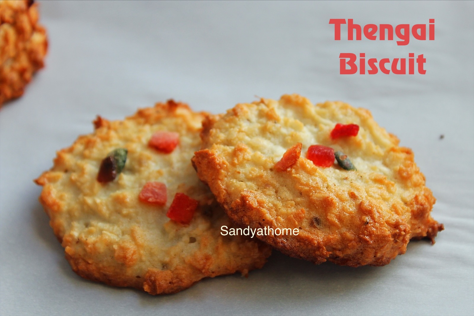 Bakery-style thengai biscuits made with coconut and egg white, served on a rustic plate