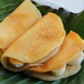 Folded maida sweet dosa with banana, served on banana leaf in Tamil Muslim style
