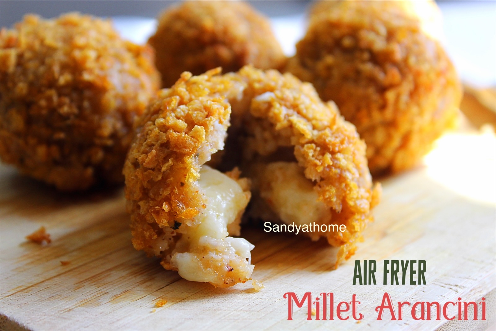 Cheddar-stuffed millet balls with golden cornflake crust