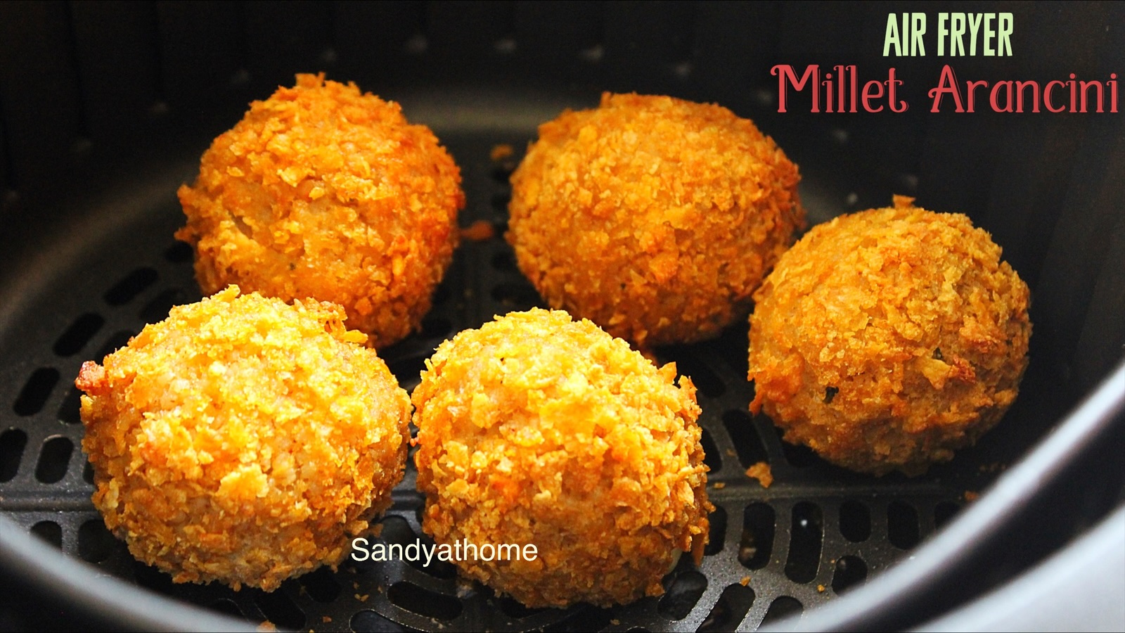 Crispy kodo millet arancini on a rustic plate
