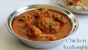 Rustic Muslim-style chicken kuzhambu in clay pot with curry leaves and coconut masala, served hot for Bakrid