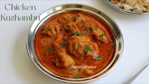 Rustic Muslim-style chicken kuzhambu in clay pot with curry leaves and coconut masala, served hot for Bakrid