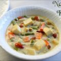 Creamy Navratan Korma curry with nine colorful ingredients like paneer, carrots, peas, cashews, and saffron, served in a royal-style brass bowl