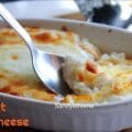 Close-up of baked millet mac and cheese topped with melted mozzarella, a wholesome fusion comfort food.