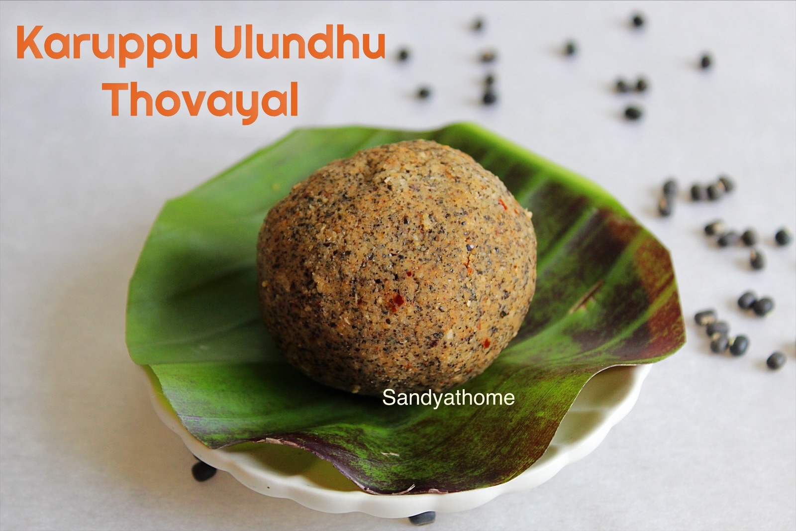 Karuppu ulundhu thogayal served on banana leaf with hot rice and ghee – a traditional Tamil thuvaiyal using black urad dal, no onion, no garlic, healthy side dish for rice, part of revival recipes and Paati’s Pot from Sandyathome blog.