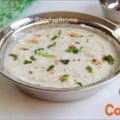 Easy summer meal made with couscous and curd topped with curry leaves and mustard seeds.