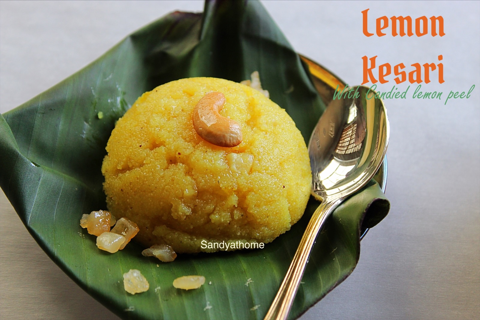 Lemon Kesari with natural golden hue from turmeric, served on banana leaf with ghee on the side
