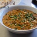 Panchmel Dal served in a brass bowl with rice — traditional Rajasthani 5 dal recipe with ghee tadka, onion, and garlic.