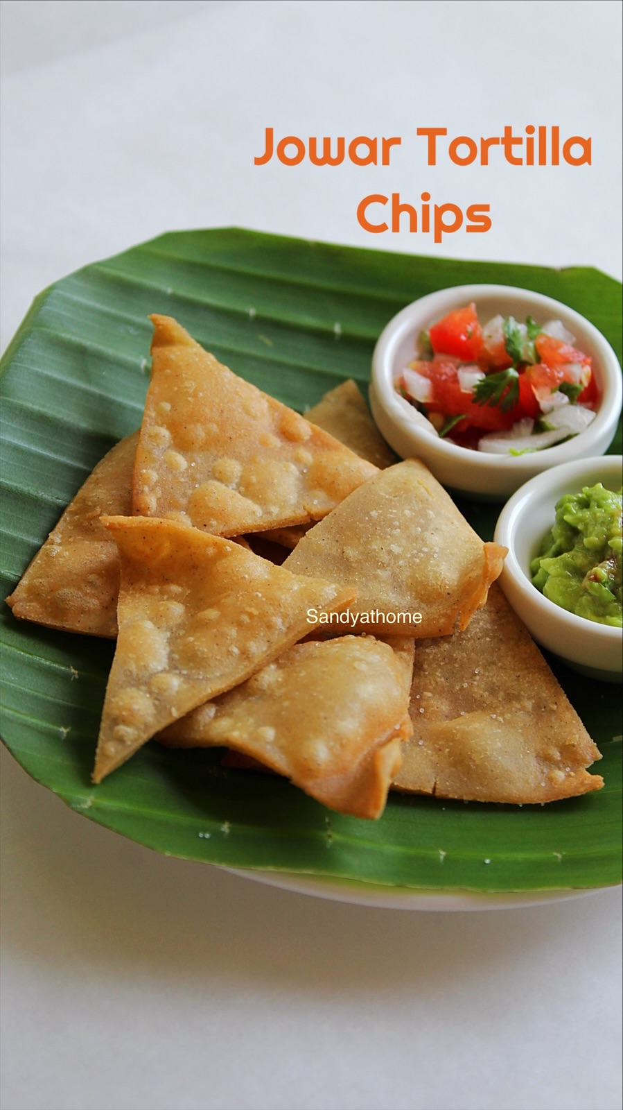 Homemade sorghum flour chips turned into Indian-style nachos with chutney, salsa, and guacamole.