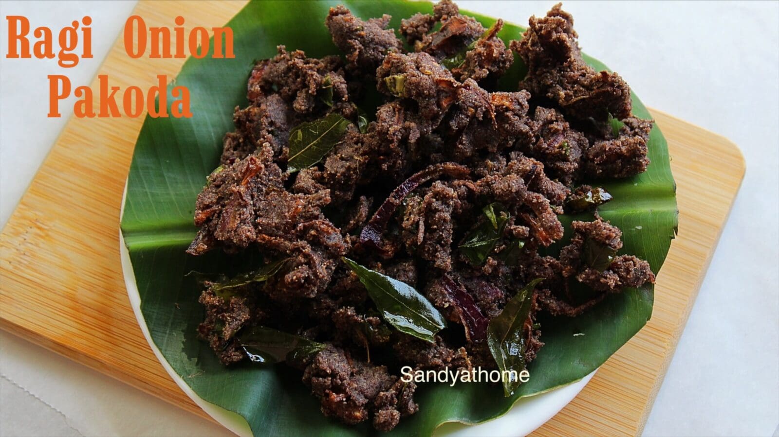 Healthy ragi pakoda served with hot chai and chutney — South Indian millet fritters made using ragi flour for a nutritious evening snack.