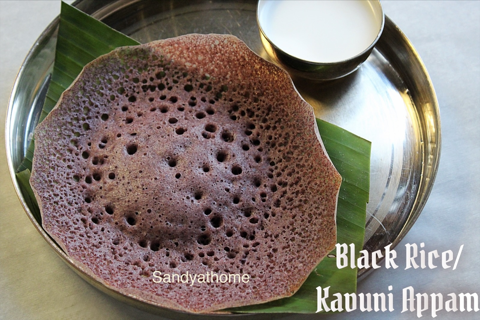 Soft kavuni appam made with black rice served with coconut milk, a traditional South Indian breakfast recipe.