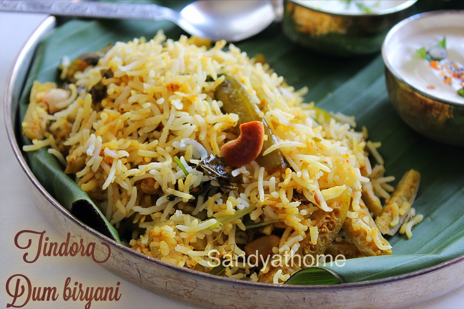 Kovakka biryani being layered with curd masala and basmati rice in a dum pot