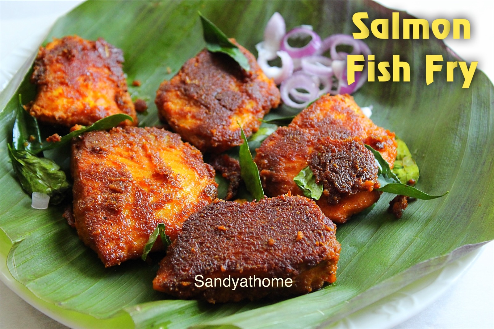 Tamil-style meen varuval using salmon fillets, fried in gingelly oil with garlic and spice masala.