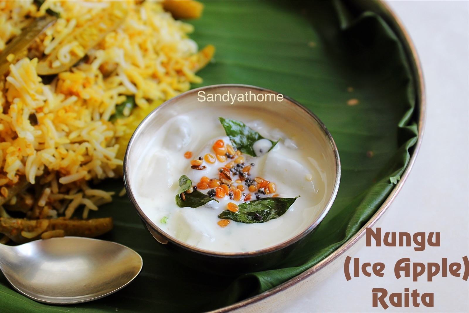 Nungu raita, Nungu perugu pachadi (ice apple curd raita) served chilled with millet pongal – a forgotten Telugu traditional recipe with no onion or garlic.
