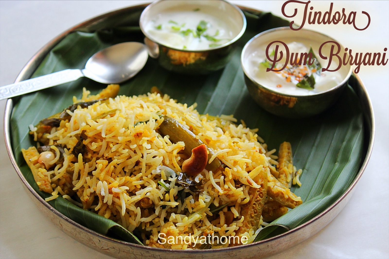 Tindora dum biryani served on a plate, made without onion or tomato, South Indian style