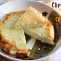 Traditional Odia Chenna Poda recipe from Sandyathome, slow-baked in banana leaf with chenna, sugar, and cardamom.