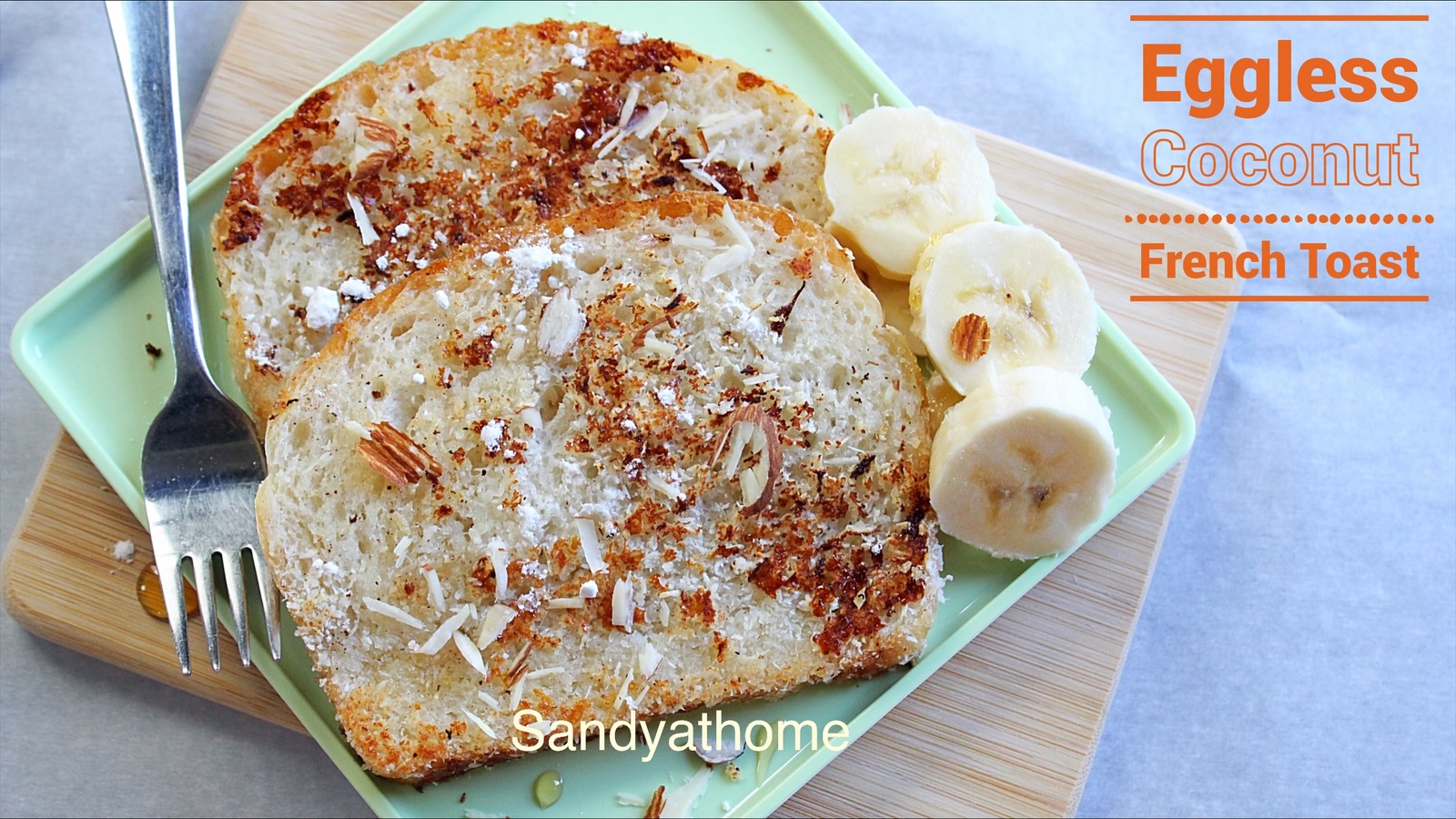 Close-up of golden coconut-coated eggless French toast with toasted coconut crust