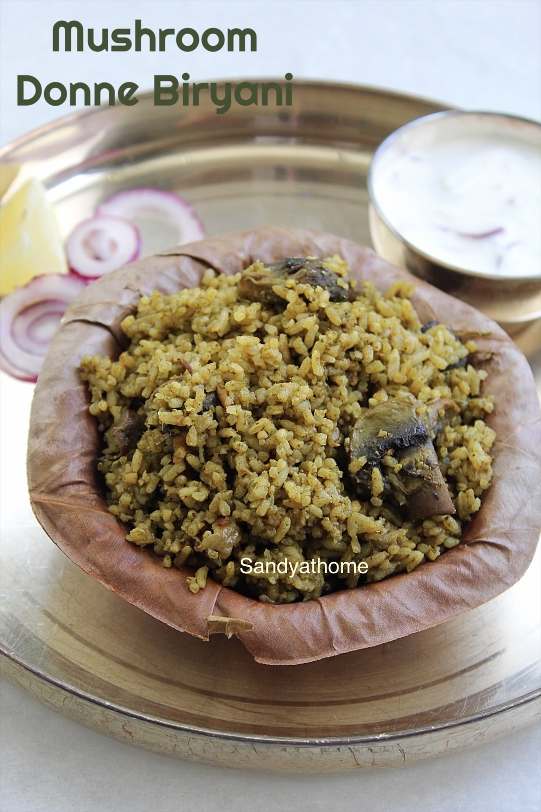 Karnataka special Mushroom Donne Biryani with green masala of mint, coriander, and chilies served in traditional style