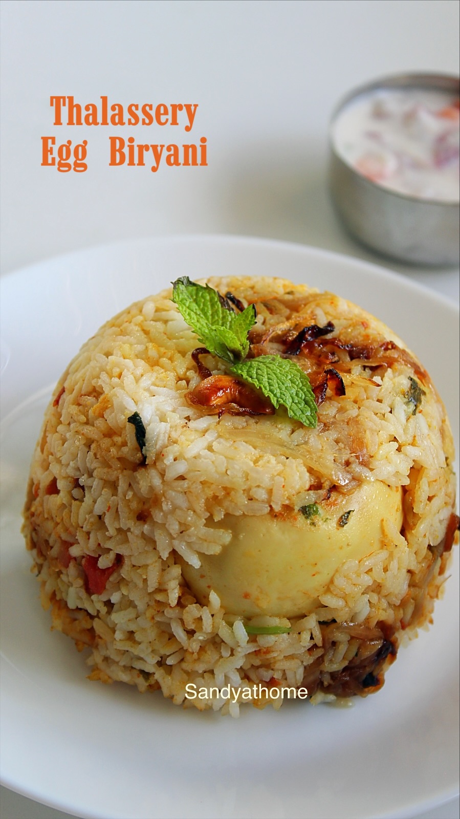 Kerala Malabar egg biryani recipe with short grain jeerakasala rice, golden onions, and cashew raisin garnish.