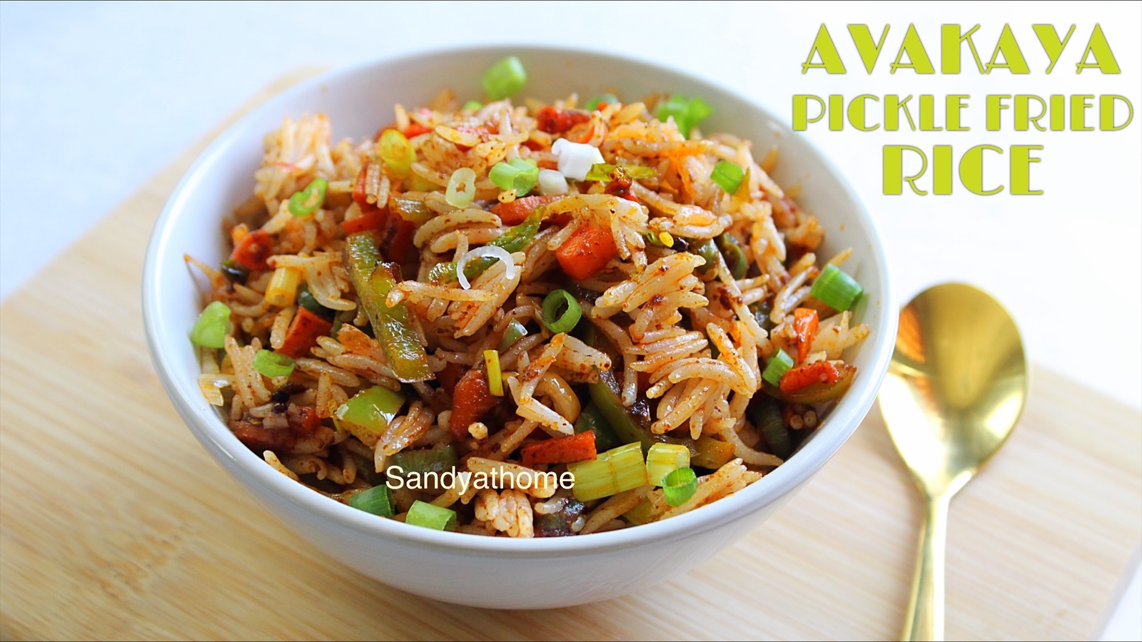 Spicy mango pickle fried rice with colorful vegetables served in a bowl