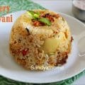Dum cooked Thalassery egg biryani topped with tawa fried onions, mint, and coriander for authentic Malabar flavor.