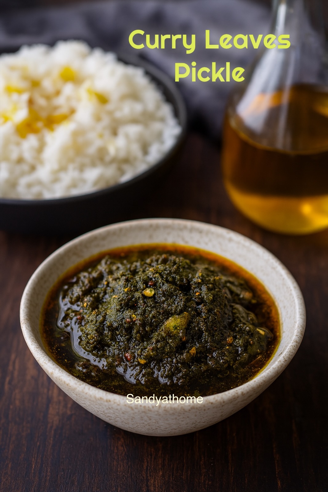 South Indian curry leaves pickle (Karuveppilai Nilavu Pachadi) served in a white bowl with gingelly oil shining on top