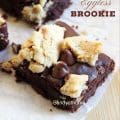 Close-up of eggless brookie bars with shiny crinkle top and gooey chocolate layers.