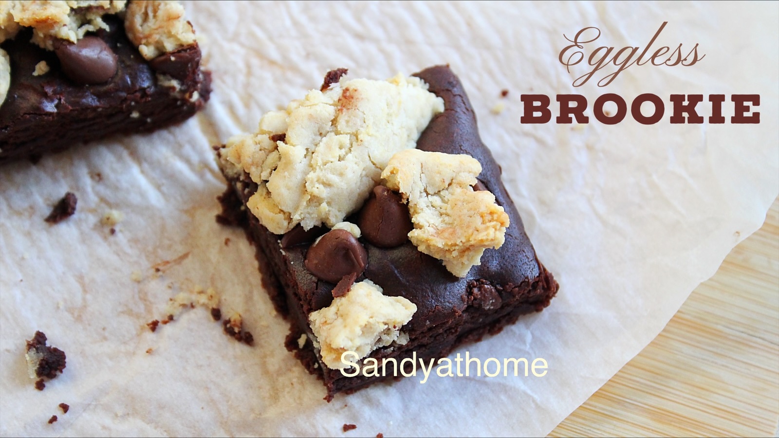 Eggless brookie recipe showing fudgy brownie base and chewy cookie top cut into squares.