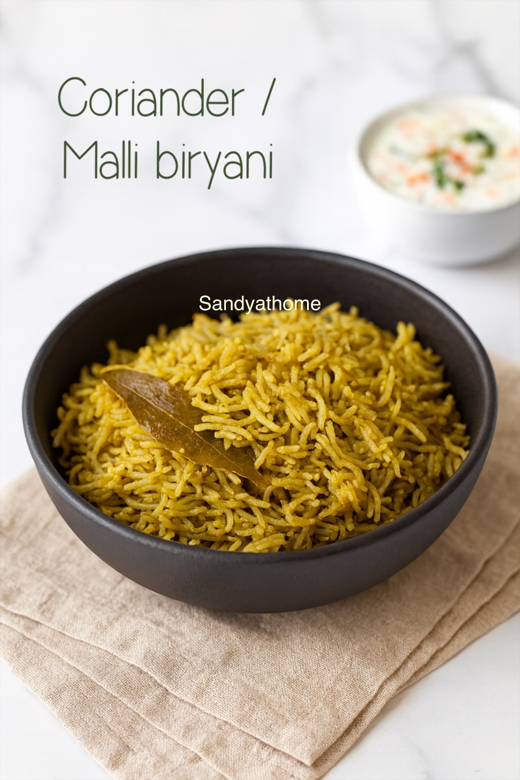 Malli Biryani, a South Indian coriander biryani with fluffy basmati rice, green color, and fresh herbal aroma served with onion raita.
