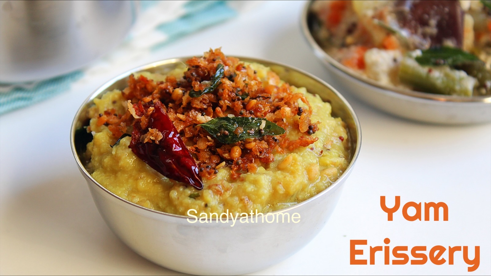 Traditional Kerala Yam Erissery with coconut and toor dal served in brass bowl.