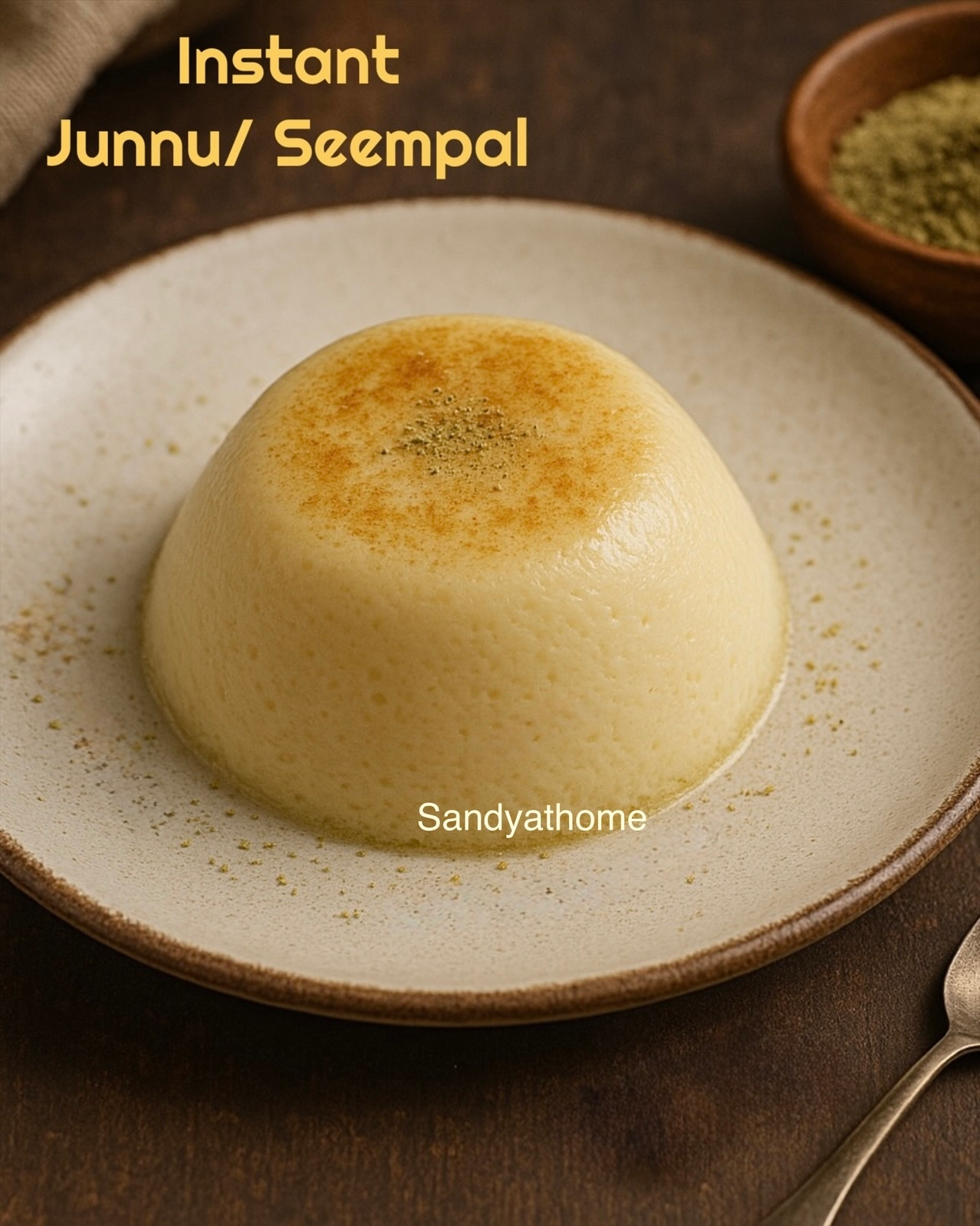 Traditional Indian junnu dessert made with instant mix, steamed to soft perfection and served with cardamom on a ceramic plate.