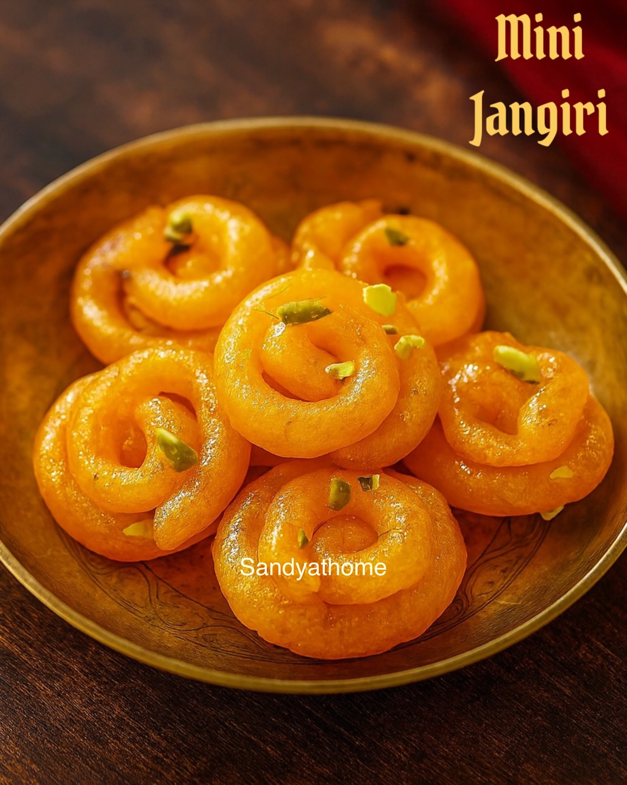 Close-up of golden mini jangiri made with turmeric, naturally colored South Indian sweet soaked in sugar syrup for Diwali.