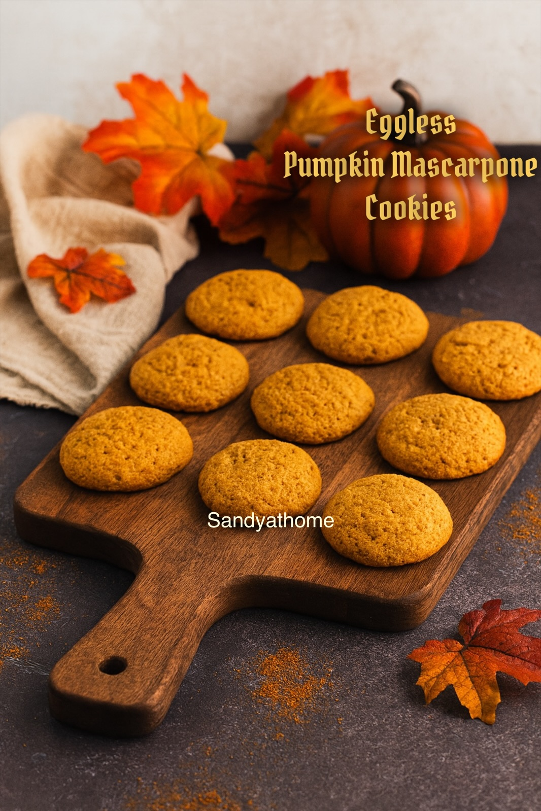 Close-up of soft and chewy pumpkin butter mascarpone cookie with powdered sugar dusting on ceramic plate