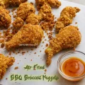 Crispy air-fried BBQ broccoli nuggets served with BBQ dipping sauce on a plate.