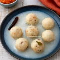 Ganji Kudumulu or Thanni Urundai — steamed rice balls cooked in rice water, classic Tamil-Telugu comfort food.