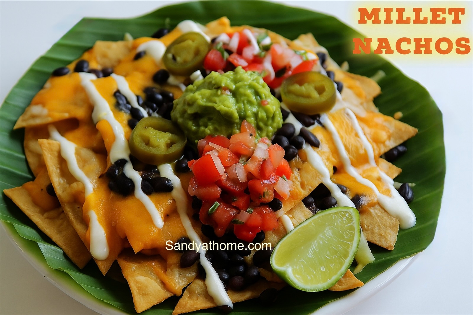 Healthy millet nachos served with homemade guacamole and fresh salsa for National Nacho Day